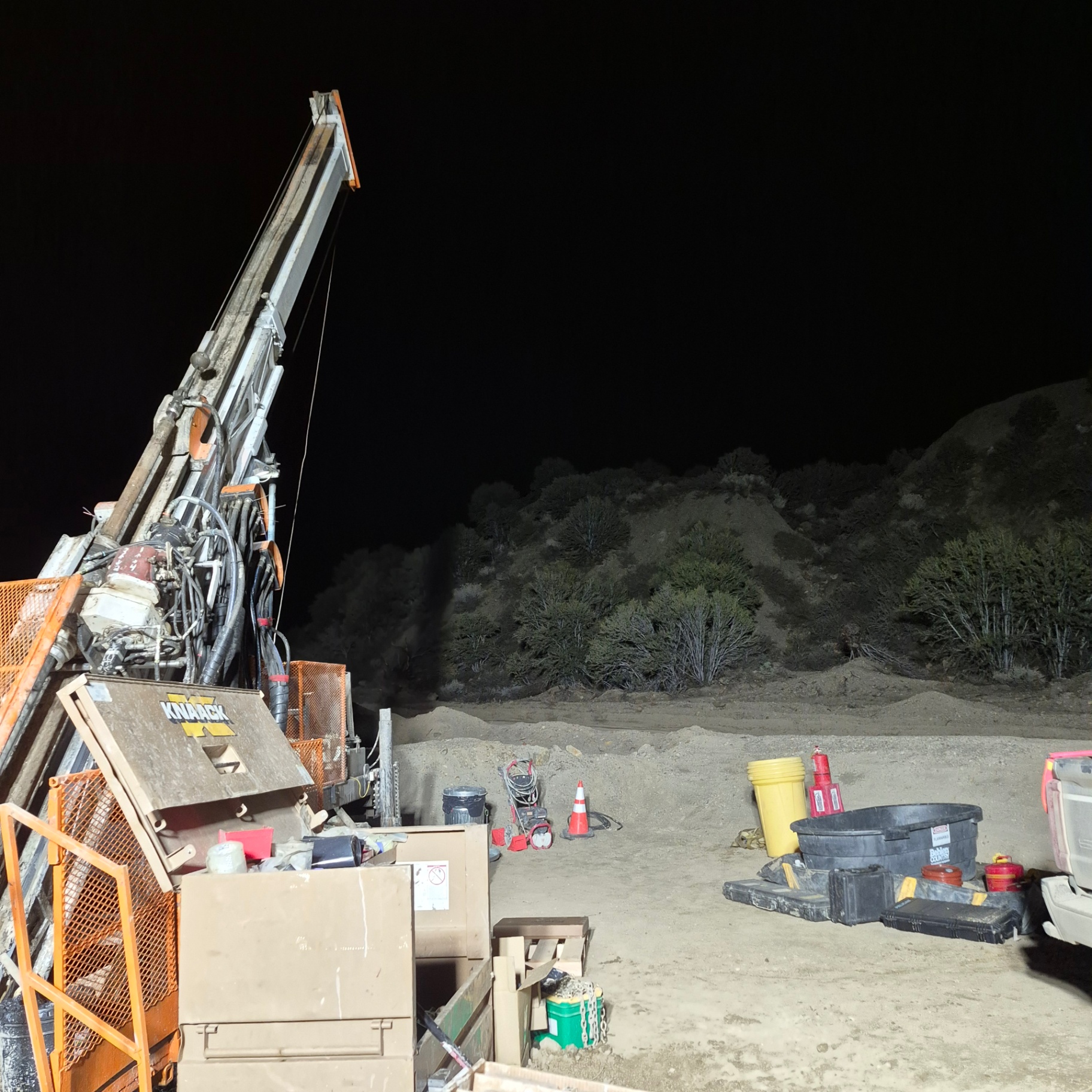 Night shift drill rig lit up on a remote Nevada pad